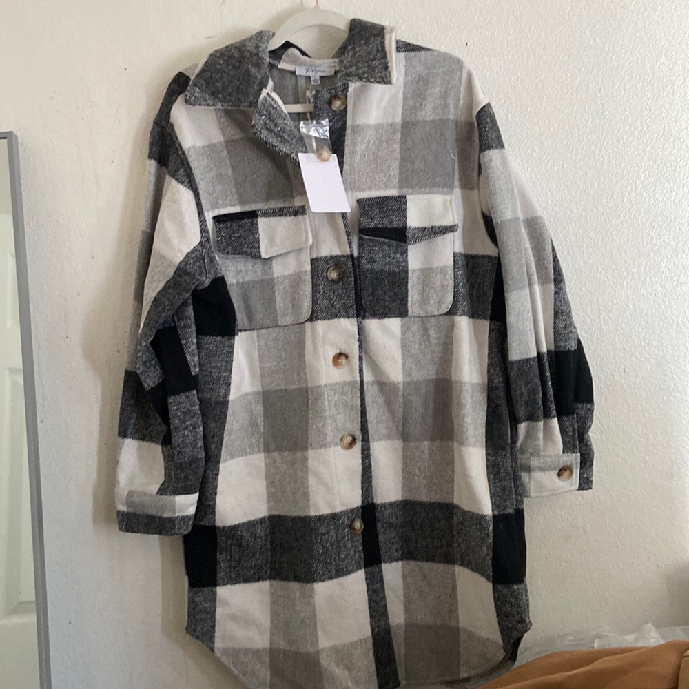 Never been worn still has tags thigh length coat
